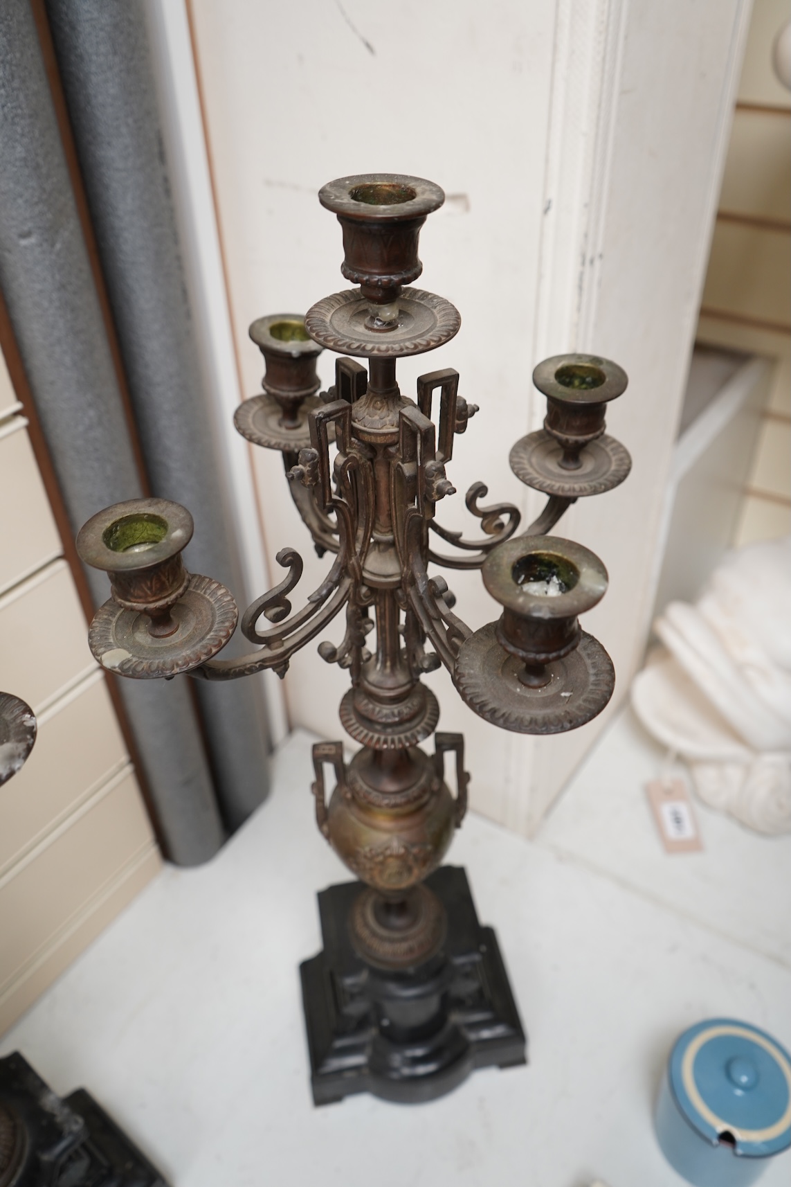 A pair of early 20th century bronze and black slate five light, four branch candelabra, 60cm high
